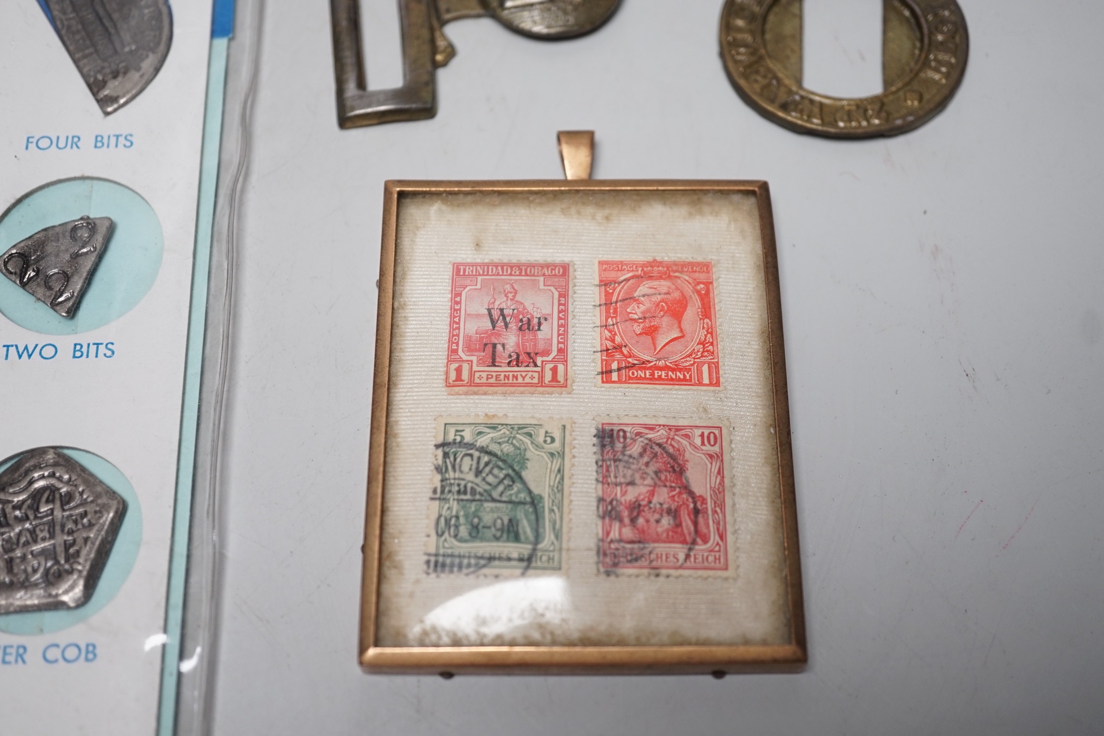 A collection of collectibles: a mother of pearl carves fish, a Mauchlin postal ruler, an enamel box and trays, coinage and various military badges etc